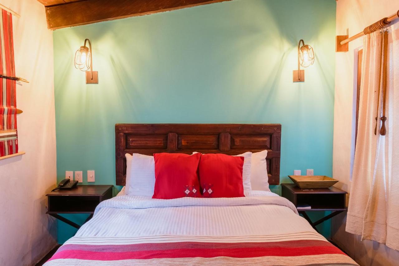 Yox Hotel Boutique San Cristóbal de Las Casas Exteriér fotografie A bedroom at the hotel