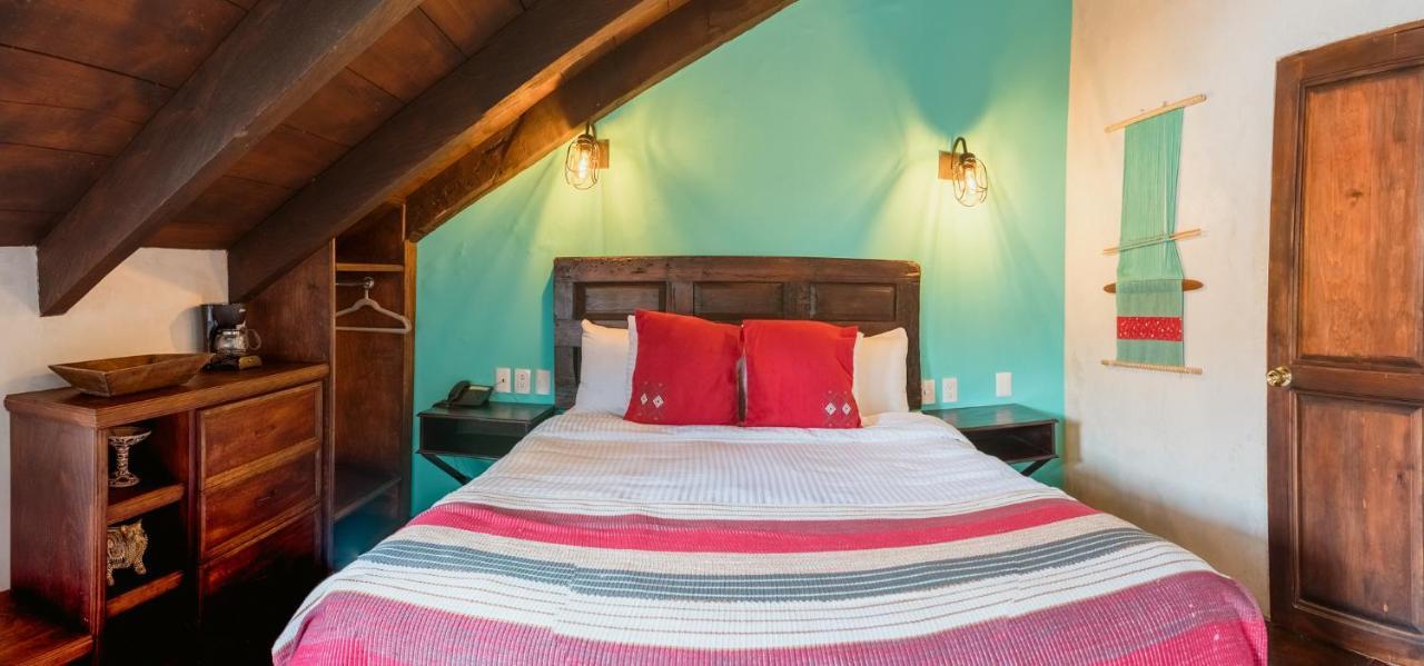 Yox Hotel Boutique San Cristóbal de Las Casas Exteriér fotografie A bedroom at the hotel